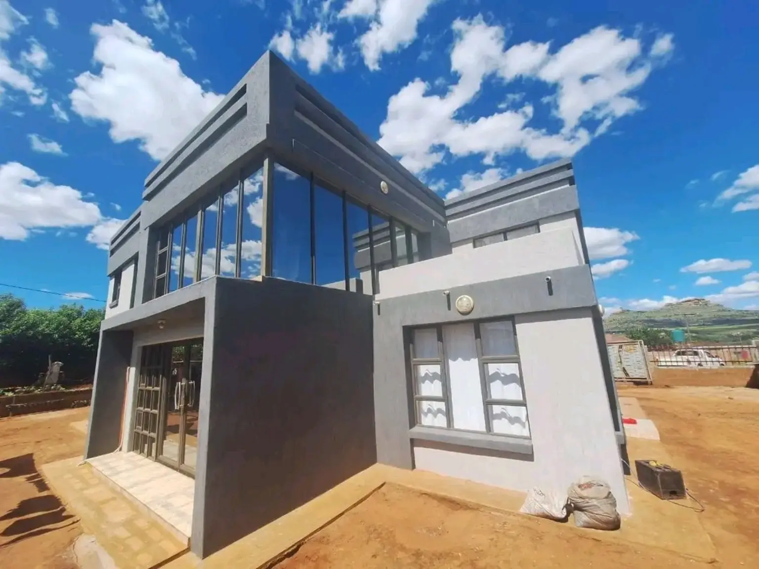 Modern home finished in charcoal and light grey Mamello coatings