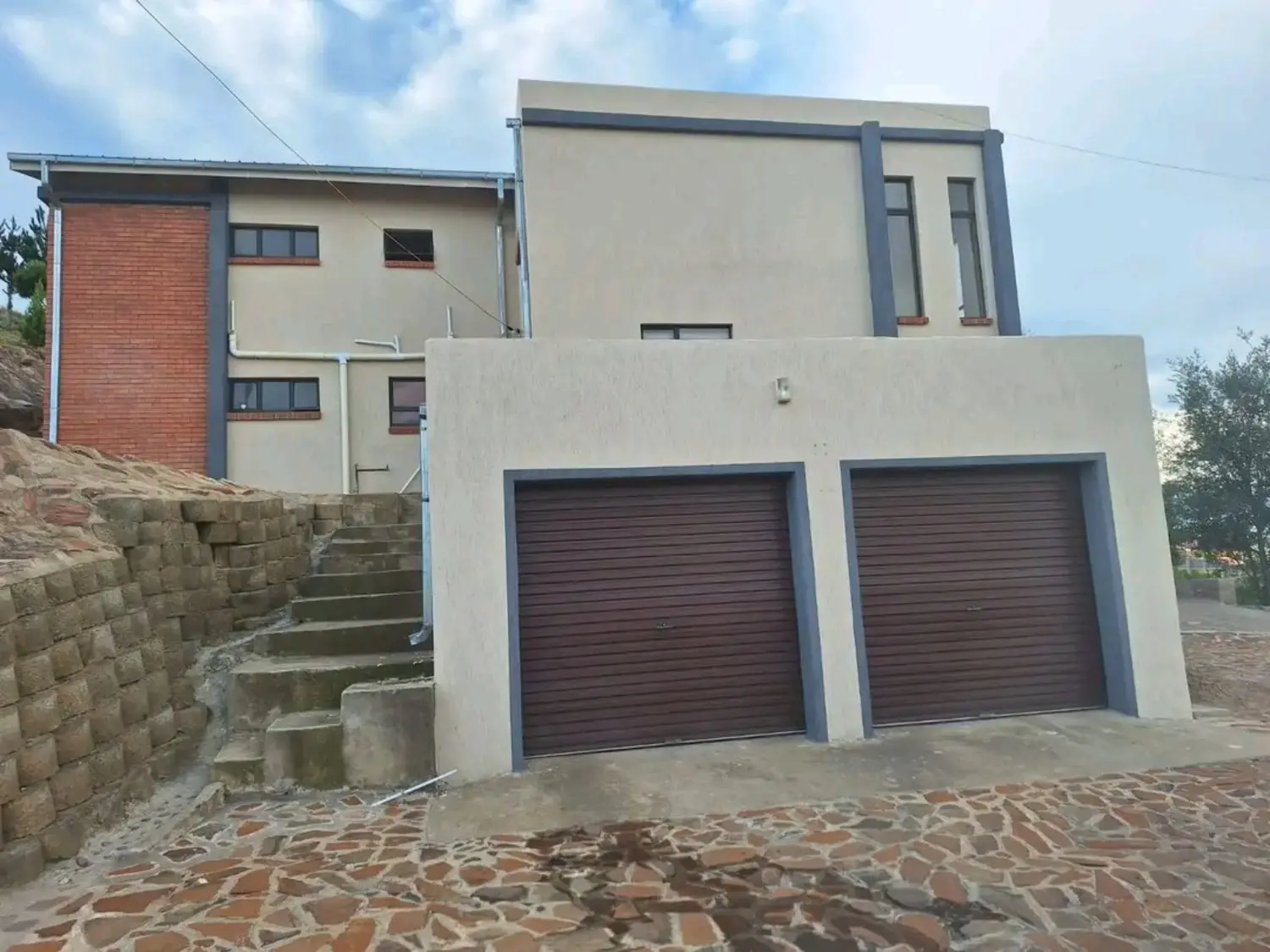 Sandstone and charcoal Mamello exterior project